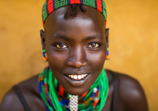 Portrait of a beautiful smiling Hamer tribe woman, Omo valley, Dimeka, Ethiopia