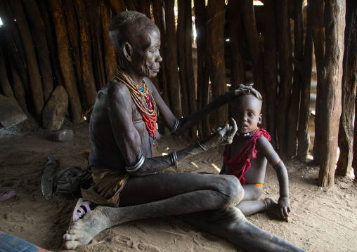 Mrs Moko who had to kill ten children she had before her wedding and who were mingis, Omo valley, Korcho, Ethiopia