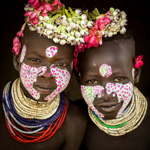 Portrait of Karo tribe children with flowers decorations, Omo valley, Korcho, Ethiopia