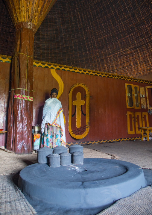 Gurage woman in front of the fireplace inside her traditional house, Gurage Zone, Butajira, Ethiopia