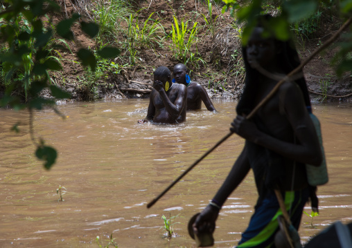 Bodi tribe fat men taking a bath before the Kael ceremony, Omo valley, Hana Mursi, Ethiopia