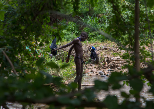 Bodi tribe men taking a bath before the Kael ceremony, Omo valley, Hana Mursi, Ethiopia