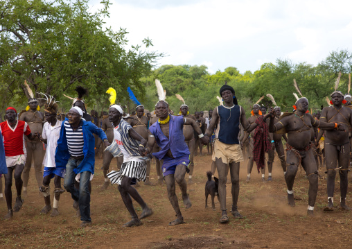 Bodi tribe fat men dancing during Kael ceremony, Omo valley, Hana Mursi, Ethiopia