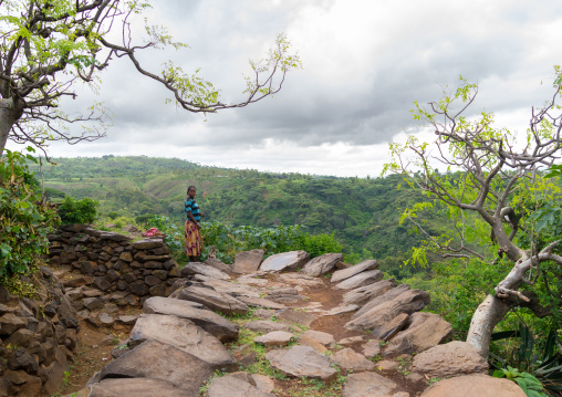 Konwo woman on a paved road in a traditional village, Omo valley, Konso, Ethiopia