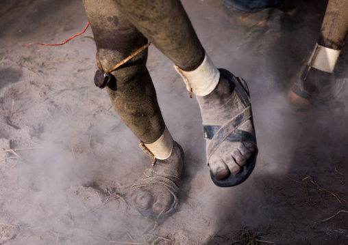 Bodi tribe fat men dancing in the dust during Kael ceremony, Omo valley, Hana Mursi, Ethiopia