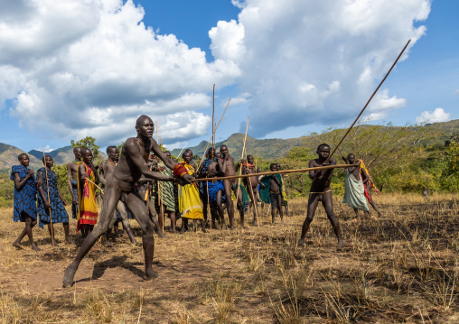 Suri tribe warriors fighting during a donga stick ritual, Omo valley, Kibish, Ethiopia