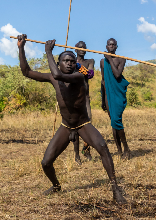 Suri tribe warriors fighting during a donga stick ritual, Omo valley, Kibish, Ethiopia