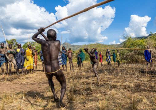 Suri tribe warriors fighting during a donga stick ritual, Omo valley, Kibish, Ethiopia