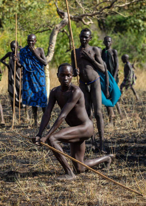 Suri tribe warriors parading before a donga stick fighting ritual, Omo valley, Kibish, Ethiopia