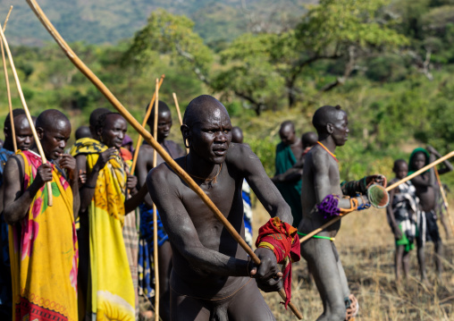 Suri tribe warriors fighting during a donga stick ritual, Omo valley, Kibish, Ethiopia