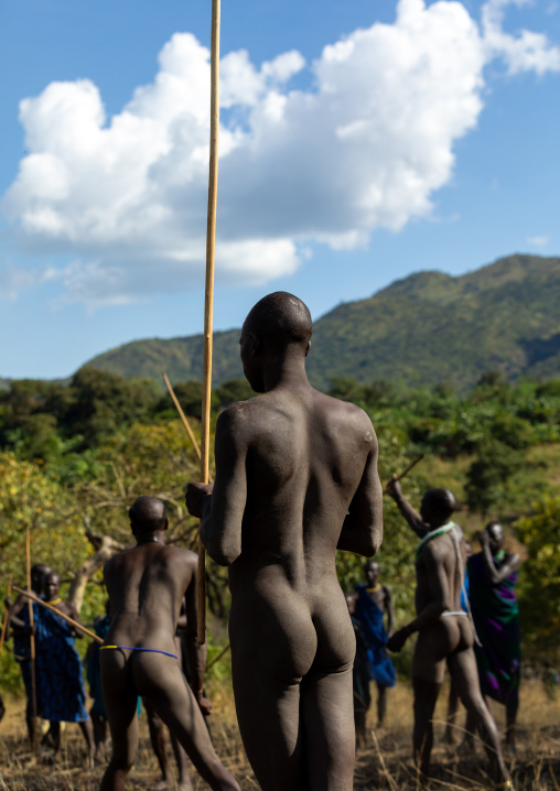 Suri tribe warriors fighting during a donga stick ritual, Omo valley, Kibish, Ethiopia