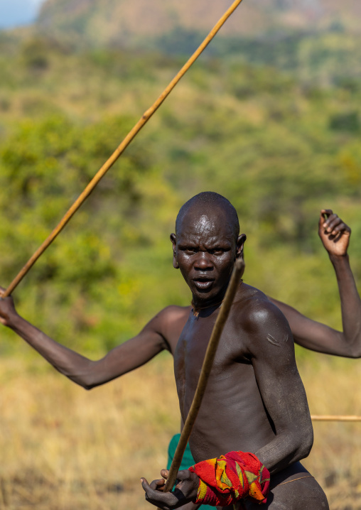 Suri tribe warriors during a donga stick fighting ritual, Omo valley, Kibish, Ethiopia