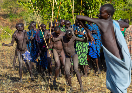 Suri tribe warriors parading before a donga stick fighting ritual, Omo valley, Kibish, Ethiopia