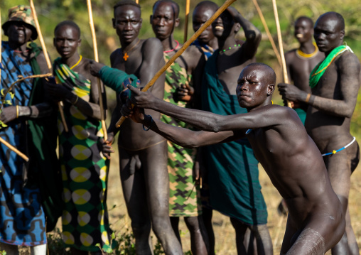 Suri tribe warriors fighting during a donga stick ritual, Omo valley, Kibish, Ethiopia