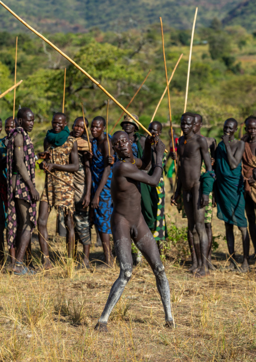 Suri tribe warriors fighting during a donga stick ritual, Omo valley, Kibish, Ethiopia