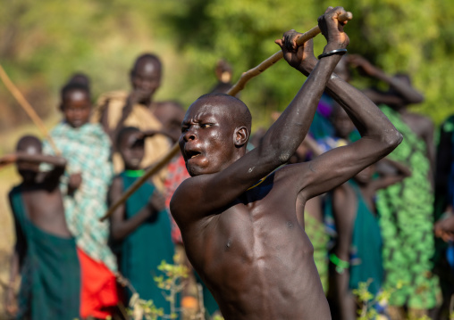 Suri tribe warriors fighting during a donga stick ritual, Omo valley, Kibish, Ethiopia