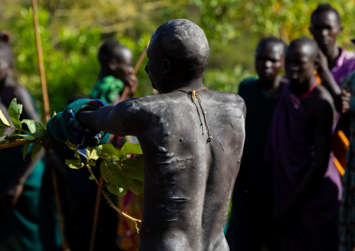 Suri tribe warriors during a donga stick fighting ritual, Omo valley, Kibish, Ethiopia