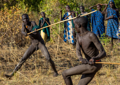 Suri tribe warriors fighting during a donga stick ritual, Omo valley, Kibish, Ethiopia