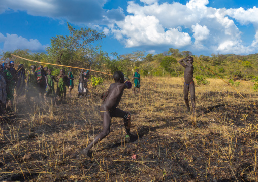 Suri tribe warriors fighting during a donga stick ritual, Omo valley, Kibish, Ethiopia