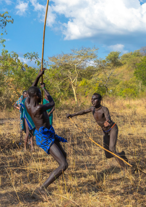 Suri tribe warriors fighting during a donga stick ritual, Omo valley, Kibish, Ethiopia