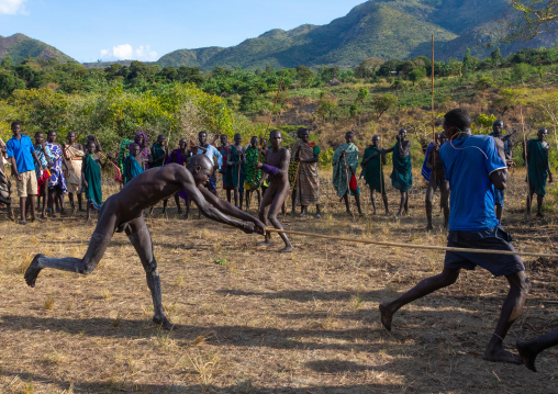 Suri tribe warriors fighting during a donga stick ritual, Omo valley, Kibish, Ethiopia