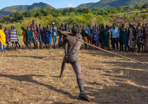 Suri tribe warriors fighting during a donga stick ritual, Omo valley, Kibish, Ethiopia