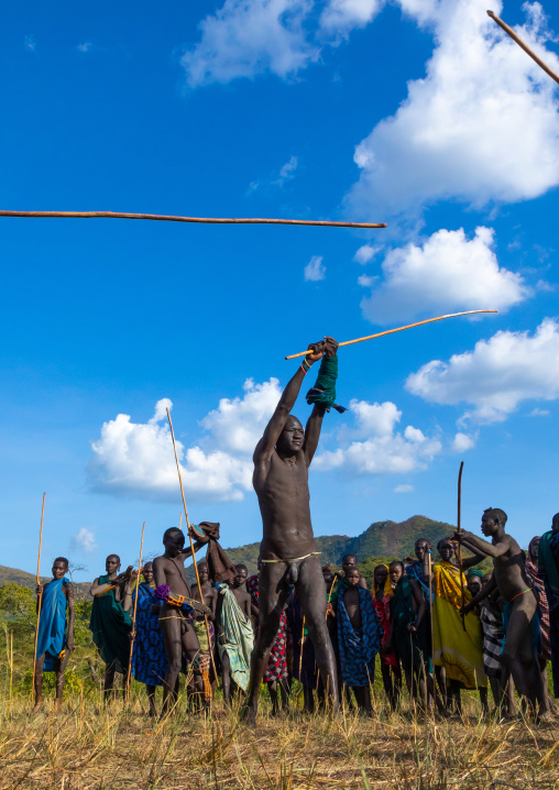 Suri tribe warriors fighting during a donga stick ritual, Omo valley, Kibish, Ethiopia