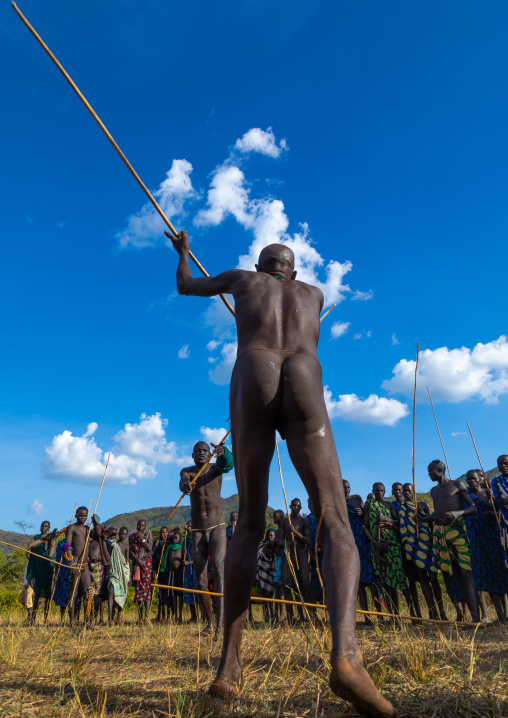 Suri tribe warriors fighting during a donga stick ritual, Omo valley, Kibish, Ethiopia