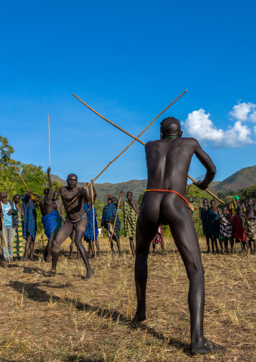 Suri tribe warriors fighting during a donga stick ritual, Omo valley, Kibish, Ethiopia