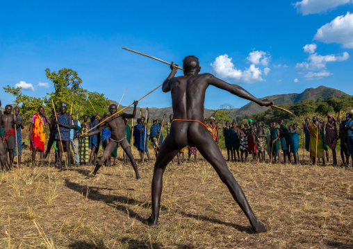 Suri tribe warriors fighting during a donga stick ritual, Omo valley, Kibish, Ethiopia