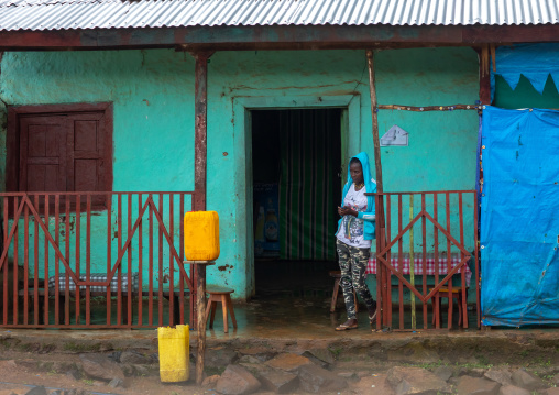 Ethiopian woman standing at the entrance of a bar, Bench Maji, Mizan Teferi, Ethiopia