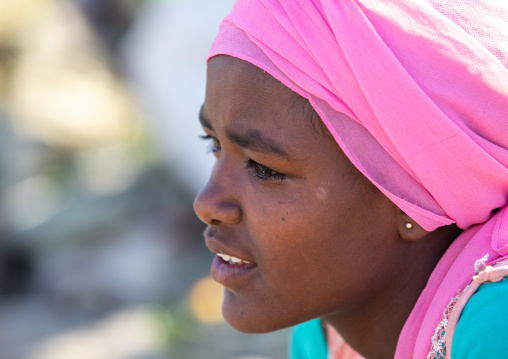 Oromo teenage girl with a pink headscarf, Amhara region, Senbete, Ethiopia