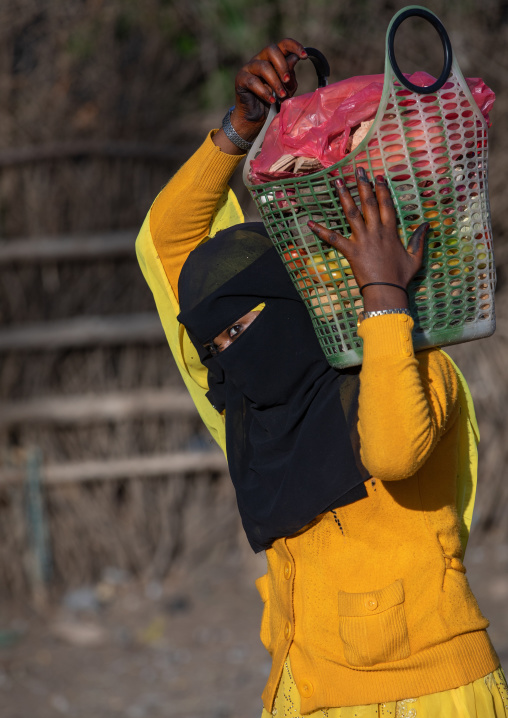 Oromo woman wearing a burqa in the market, Amhara region, Senbete, Ethiopia