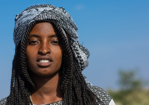 Portrait of a smiling afar woman, Afar region, Mile, Ethiopia