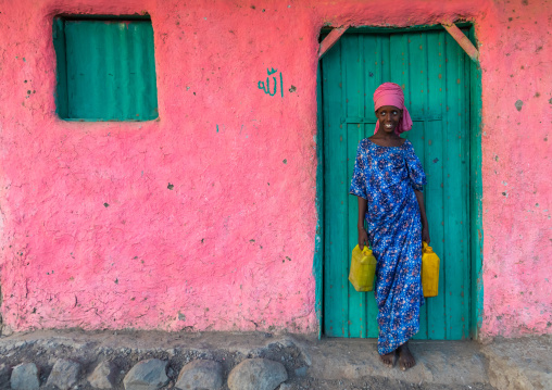 Portrait of an afar tribe girl with water jerricans, Afar Region, Afambo, Ethiopia