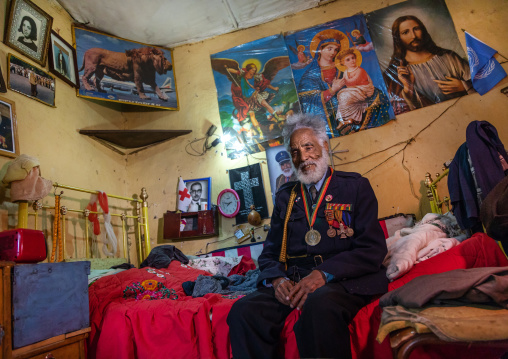 Veteran from the italo-ethiopian war in army uniform inside his home, Addis Abeba region, Addis Ababa, Ethiopia