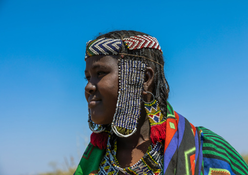 Portrait of an issa tribe woman with a beaded headwear, Afar Region, Gewane, Ethiopia