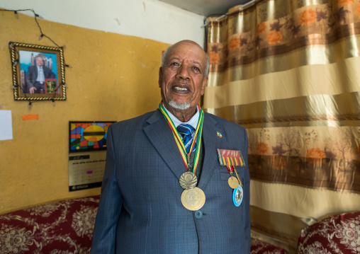 Ethiopian veteran from the italo-ethiopian war in army uniform in his home, Addis Ababa Region, Addis Ababa, Ethiopia