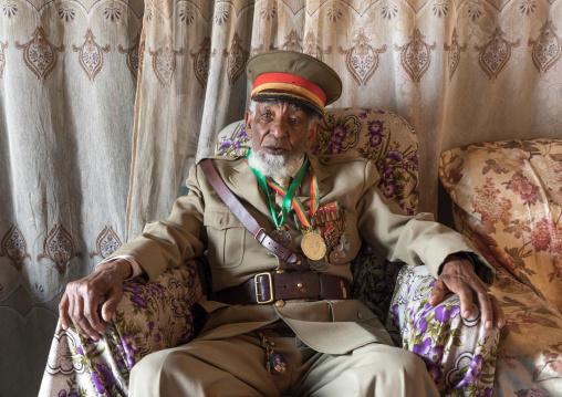 Ethiopian veteran from the italo-ethiopian war in army uniform in his home, Addis Ababa Region, Addis Ababa, Ethiopia