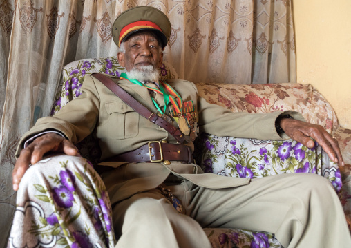 Ethiopian veteran from the italo-ethiopian war in army uniform in his home, Addis Ababa Region, Addis Ababa, Ethiopia