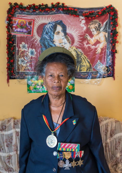 Ethiopian veteran woman from the italo-ethiopian war with a virgin mary decoration, Addis Ababa Region, Addis Ababa, Ethiopia