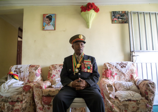 Ethiopian veteran from the italo-ethiopian war in army uniform in his home, Addis Ababa Region, Addis Ababa, Ethiopia