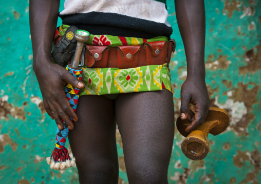 Tribe Man Holding His Headrest With Mobile Phone And Knife, Key Afer, Omo Valley, Ethiopia