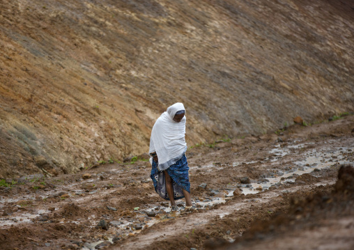 Old Woman Walking In The Mud, Hossana, Omo Valley, Ethiopia