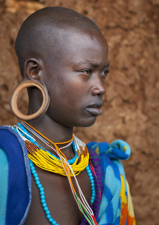 Suri tribe girl with enlarged earlobe, Kibish, Omo valley, Ethiopia