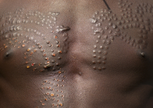 Detail of a Suri tribe man's scarifications, Kibish, Omo valley, Ethiopia