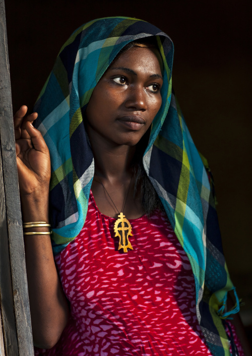 Young waitress with a veil in hana mursi hotel, Omo valley, Ethiopia