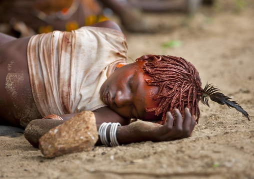 Young Hamar Tribe Girl Sleeping At A Bull Jumping Ceremony, Turmi, Omo Valley, Ethiopia