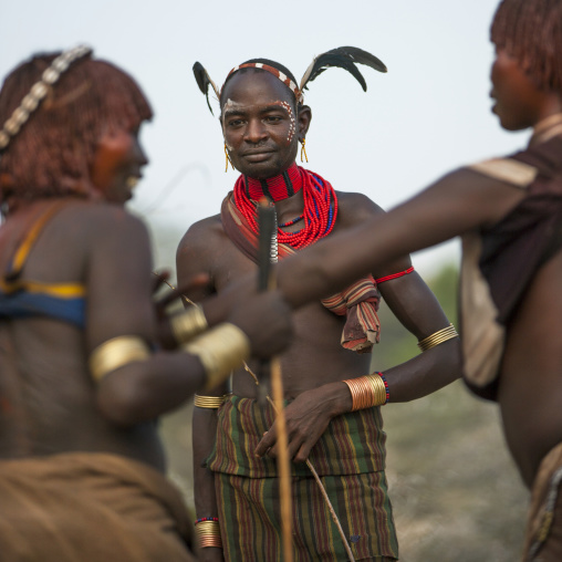 Women Arguing To Be Whipped By The Maze During Bull Jumping Ceremony, Turmi In Hamar Tribe, Omo Valley, Ethiopia