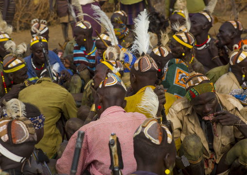 Dassanech Tribe Warriors Sharing Cow Meat During A Ceremony, Omorate, Omo Valley, Ethiopia